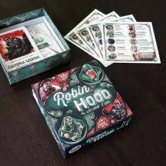 Planszowa gra robin hood gra, gdzie gracze wcielają się w postacie z Sherwood. Zestaw zawiera pudełko, karty postaci i inne elementy.
