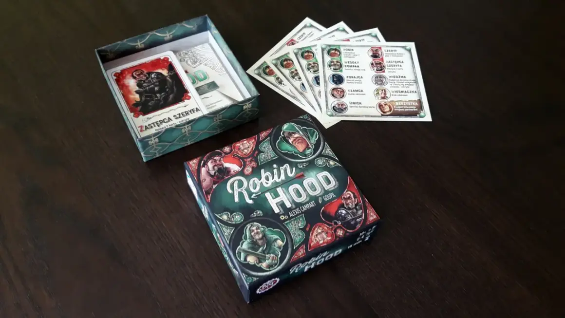 Planszowa gra robin hood gra, gdzie gracze wcielają się w postacie z Sherwood. Zestaw zawiera pudełko, karty postaci i inne elementy.